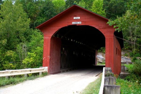 Red covered bridge in Vermont countryside